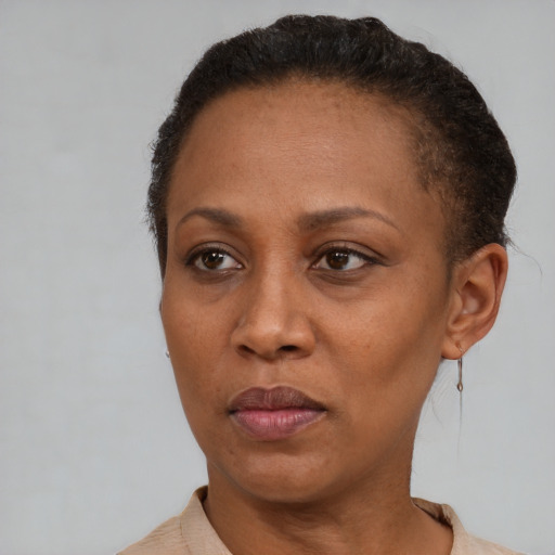 Neutral black adult female with short  brown hair and brown eyes