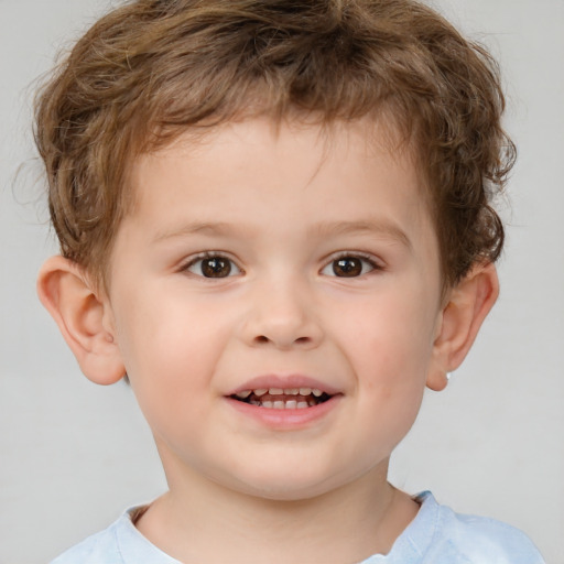 Joyful white child male with short  brown hair and brown eyes