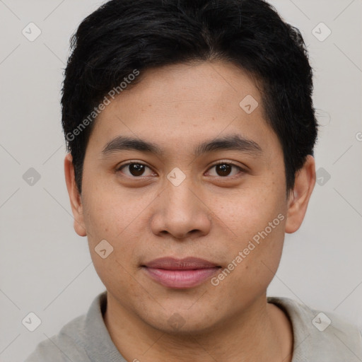 Joyful asian young-adult male with short  brown hair and brown eyes