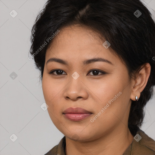 Joyful latino young-adult female with long  brown hair and brown eyes