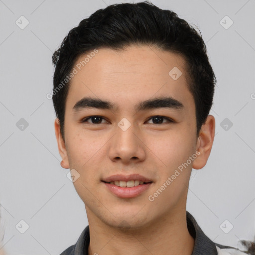 Joyful asian young-adult male with short  black hair and brown eyes