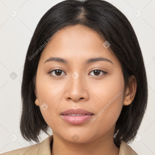 Joyful latino young-adult female with medium  brown hair and brown eyes