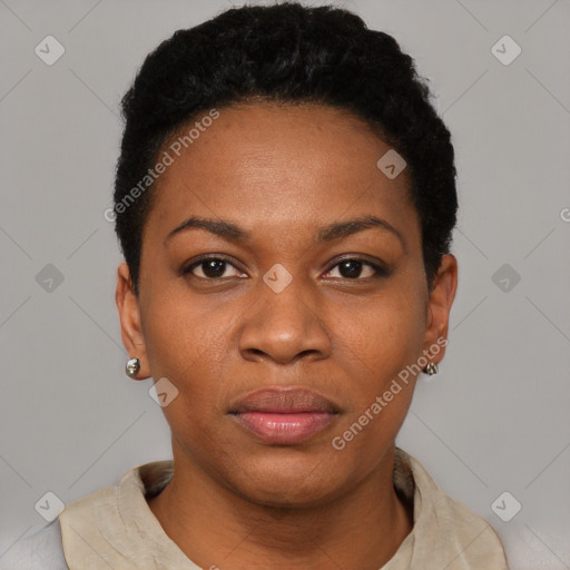 Joyful black young-adult female with short  black hair and brown eyes