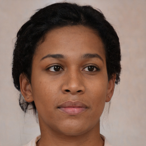 Neutral black young-adult female with medium  brown hair and brown eyes