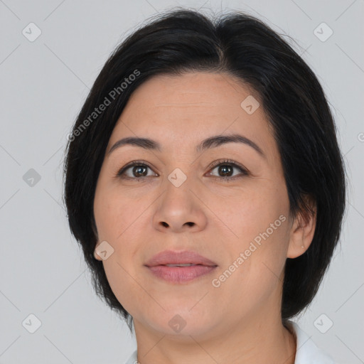 Joyful asian adult female with medium  brown hair and brown eyes