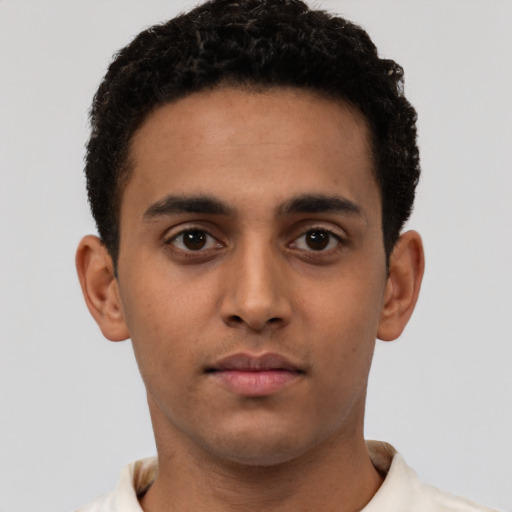 Neutral latino young-adult male with short  brown hair and brown eyes