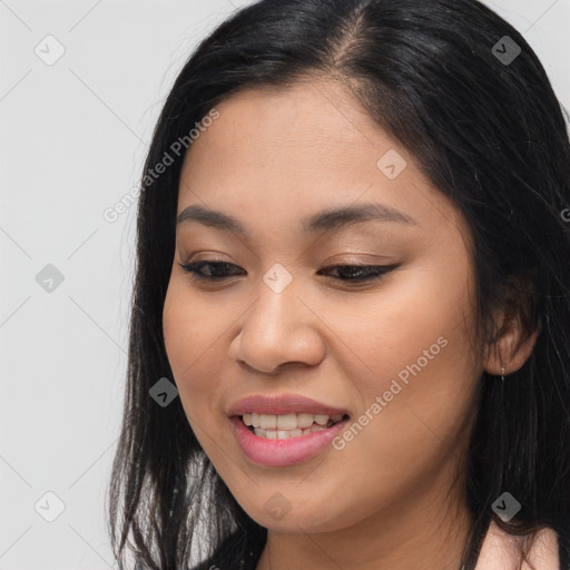 Joyful white young-adult female with long  brown hair and brown eyes