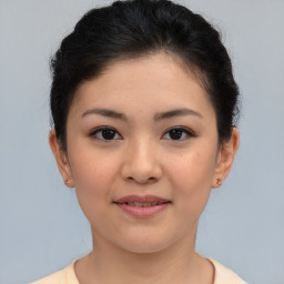 Joyful asian young-adult female with short  brown hair and brown eyes