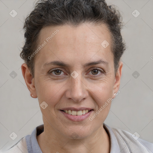 Joyful white adult female with short  brown hair and brown eyes