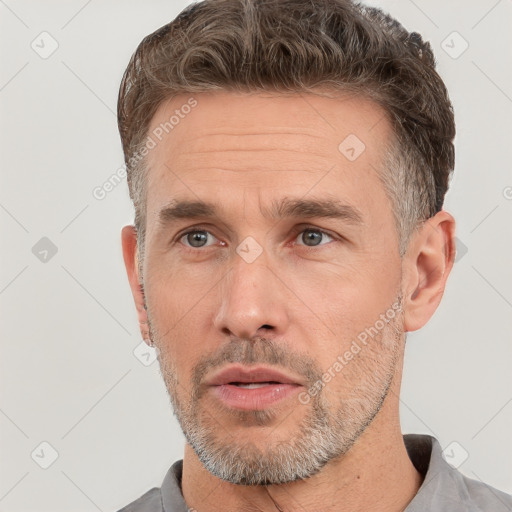 Neutral white adult male with short  brown hair and brown eyes