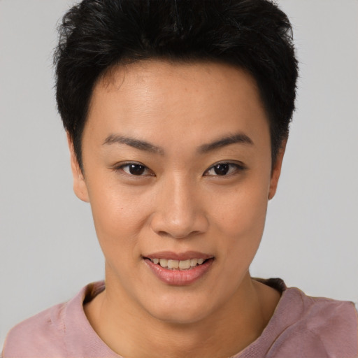 Joyful asian young-adult female with short  black hair and brown eyes