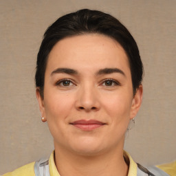 Joyful white young-adult female with short  brown hair and brown eyes