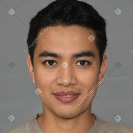 Joyful latino young-adult male with short  black hair and brown eyes