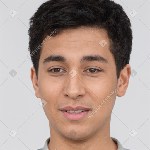 Joyful white young-adult male with short  black hair and brown eyes