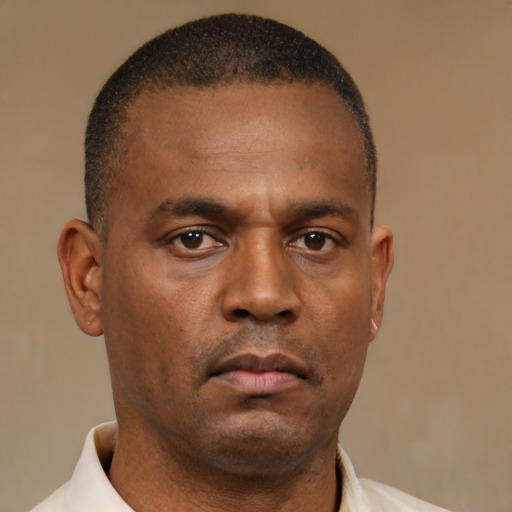 Neutral latino adult male with short  brown hair and brown eyes