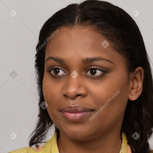 Joyful black young-adult female with medium  brown hair and brown eyes