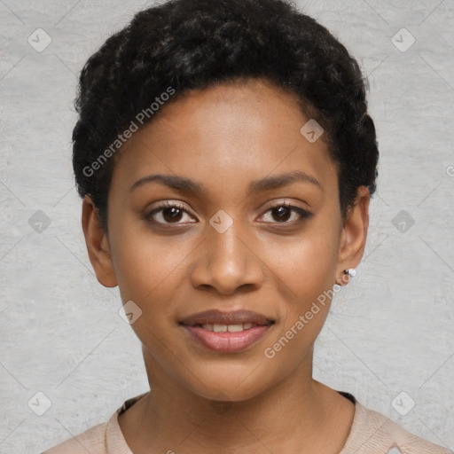 Joyful black young-adult female with short  black hair and brown eyes