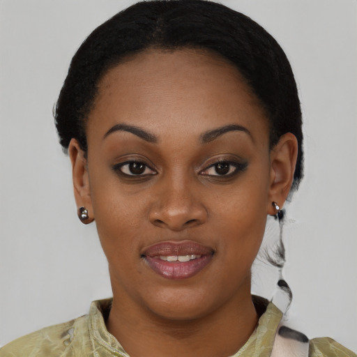 Joyful black young-adult female with short  black hair and brown eyes