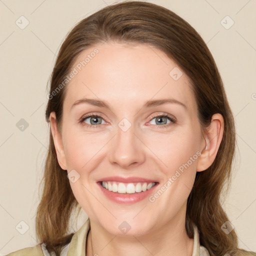 Joyful white young-adult female with long  brown hair and grey eyes