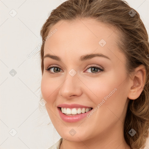 Joyful white young-adult female with long  brown hair and green eyes