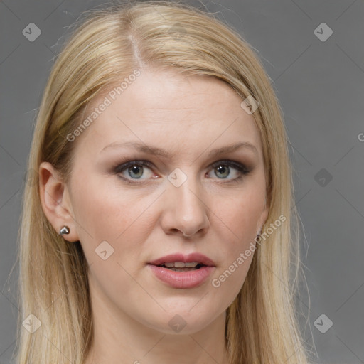 Joyful white adult female with long  brown hair and grey eyes