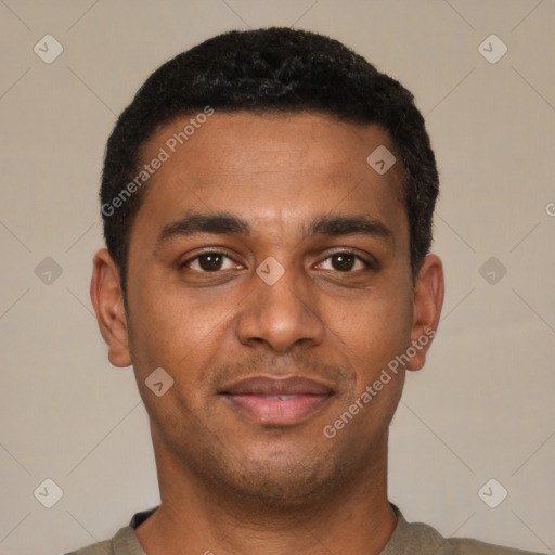 Joyful black young-adult male with short  black hair and brown eyes