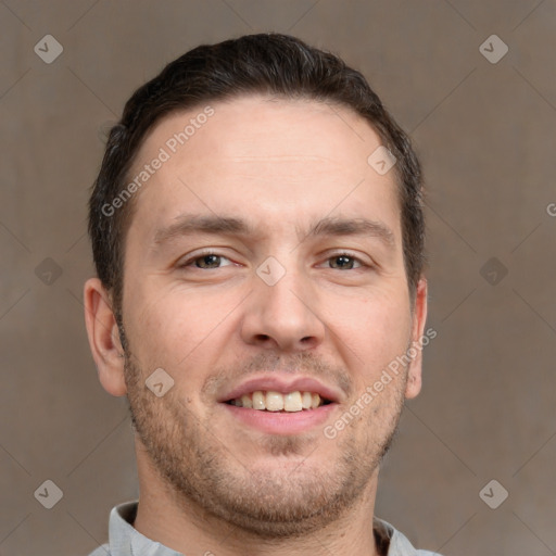 Joyful white adult male with short  brown hair and brown eyes