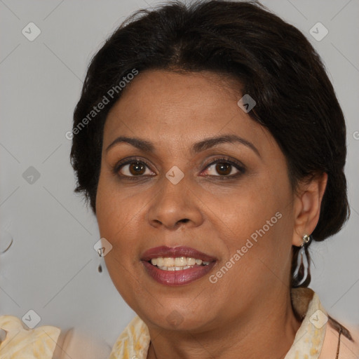 Joyful black adult female with medium  brown hair and brown eyes