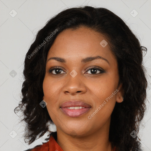 Joyful black young-adult female with long  brown hair and brown eyes