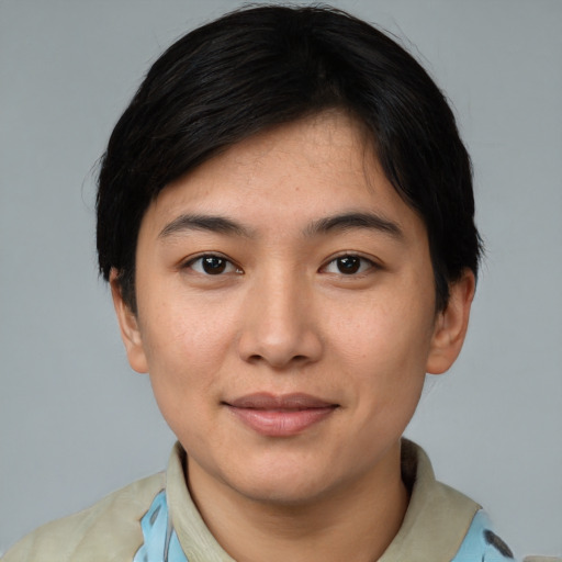 Joyful asian young-adult female with short  black hair and brown eyes