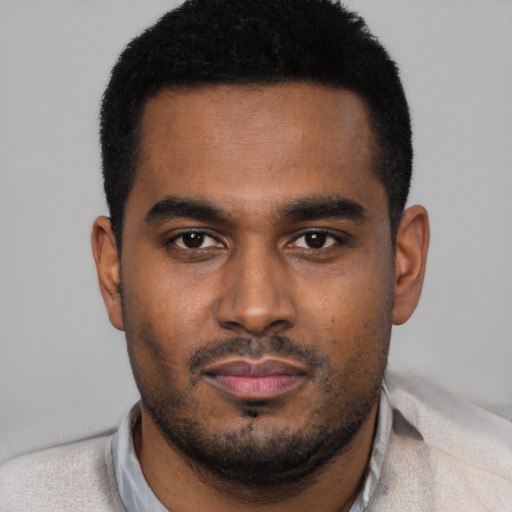 Neutral black young-adult male with short  black hair and brown eyes