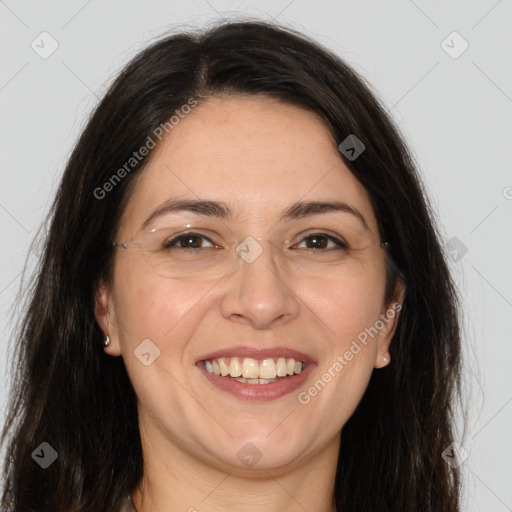 Joyful white adult female with long  brown hair and brown eyes