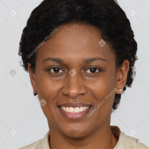 Joyful black adult female with short  brown hair and brown eyes