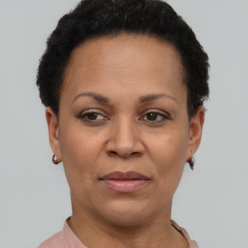 Joyful black adult female with short  brown hair and brown eyes