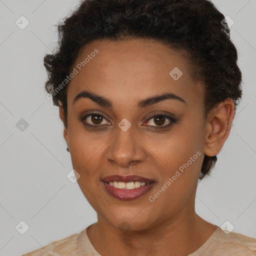 Joyful black young-adult female with short  brown hair and brown eyes