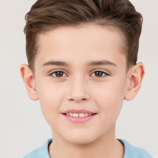 Joyful white child male with short  brown hair and brown eyes