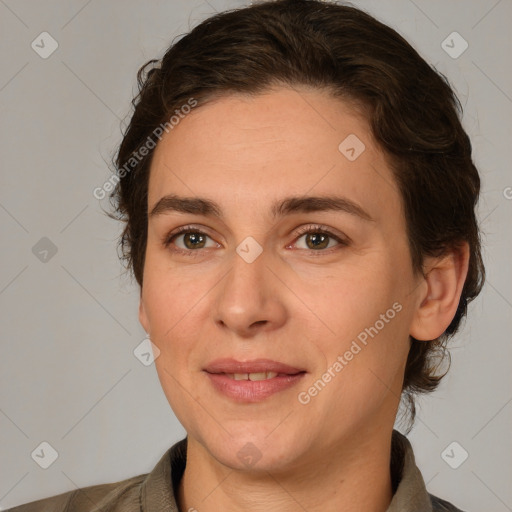 Joyful white adult female with medium  brown hair and brown eyes