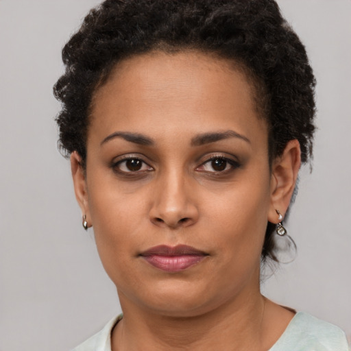 Neutral black young-adult female with short  brown hair and brown eyes