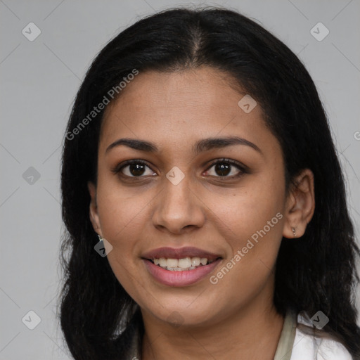 Joyful latino young-adult female with long  brown hair and brown eyes