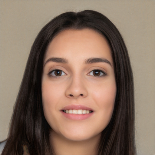 Joyful white young-adult female with long  black hair and brown eyes