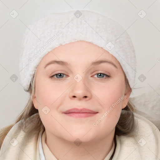 Joyful white young-adult female with medium  brown hair and blue eyes