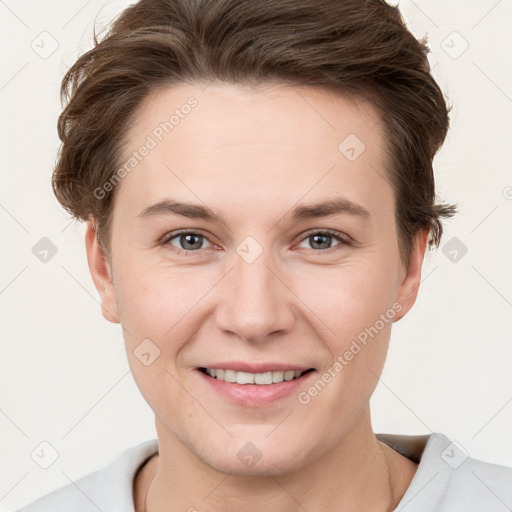 Joyful white young-adult female with short  brown hair and grey eyes