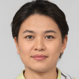 Joyful asian young-adult female with short  brown hair and brown eyes