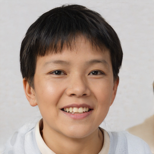Joyful white child male with short  brown hair and brown eyes