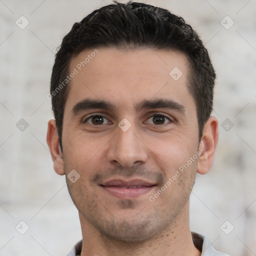 Joyful white young-adult male with short  black hair and brown eyes