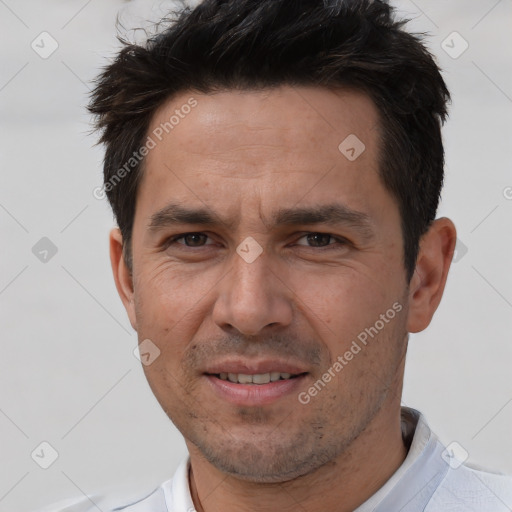 Joyful white adult male with short  brown hair and brown eyes