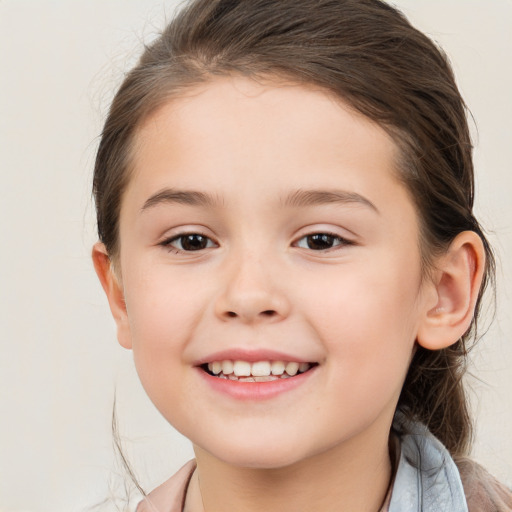 Joyful white child female with medium  brown hair and brown eyes