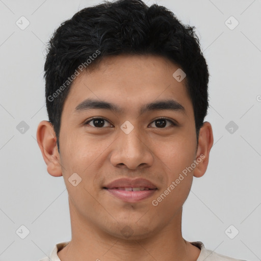 Joyful asian young-adult male with short  black hair and brown eyes