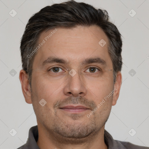 Joyful white adult male with short  brown hair and brown eyes