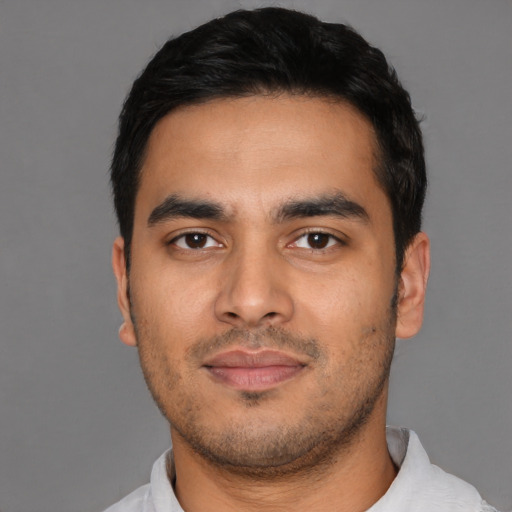 Neutral latino young-adult male with short  black hair and brown eyes
